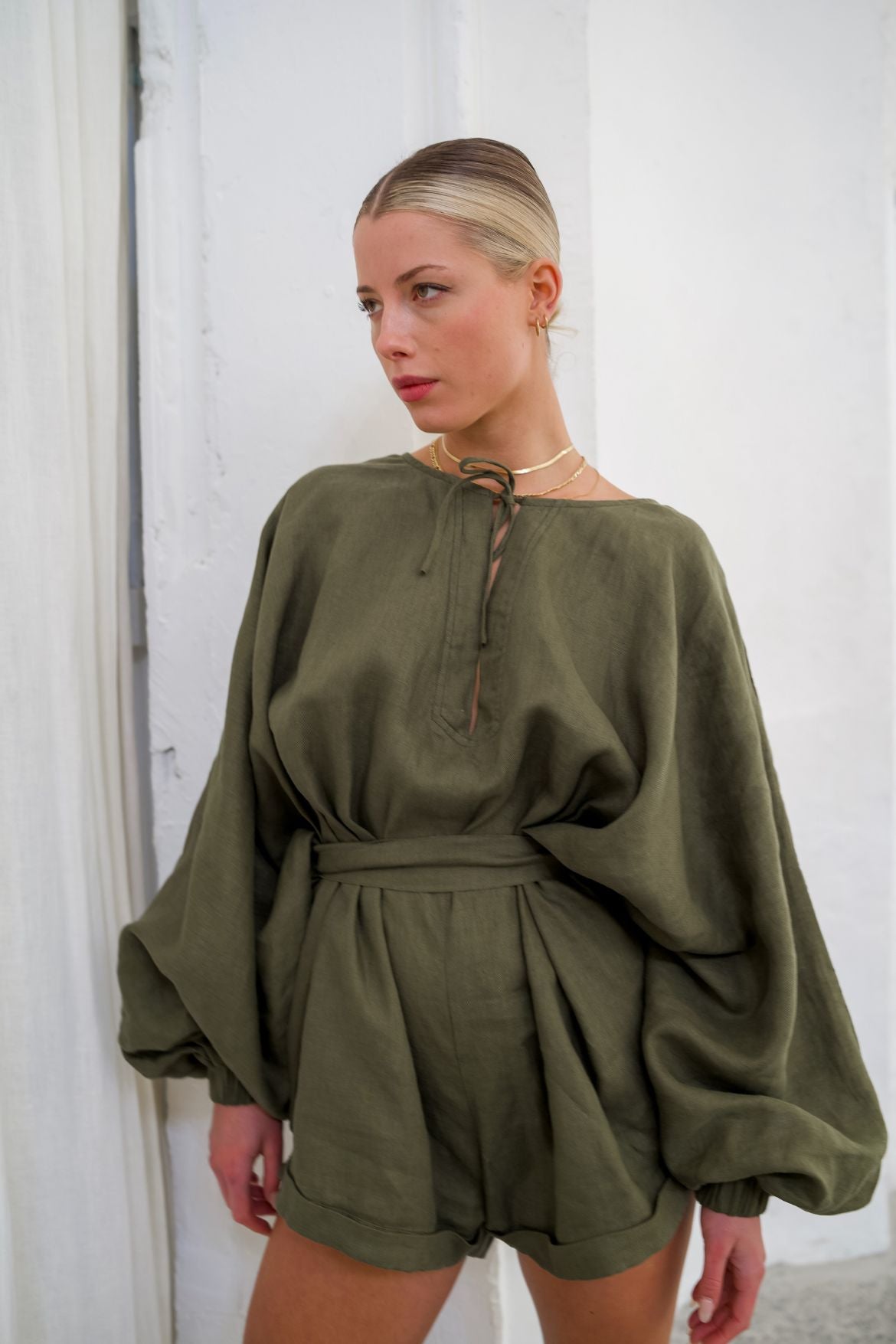 The Ease Keros Romper Olive - Linen olive coloured romper in batwing style with waist tie