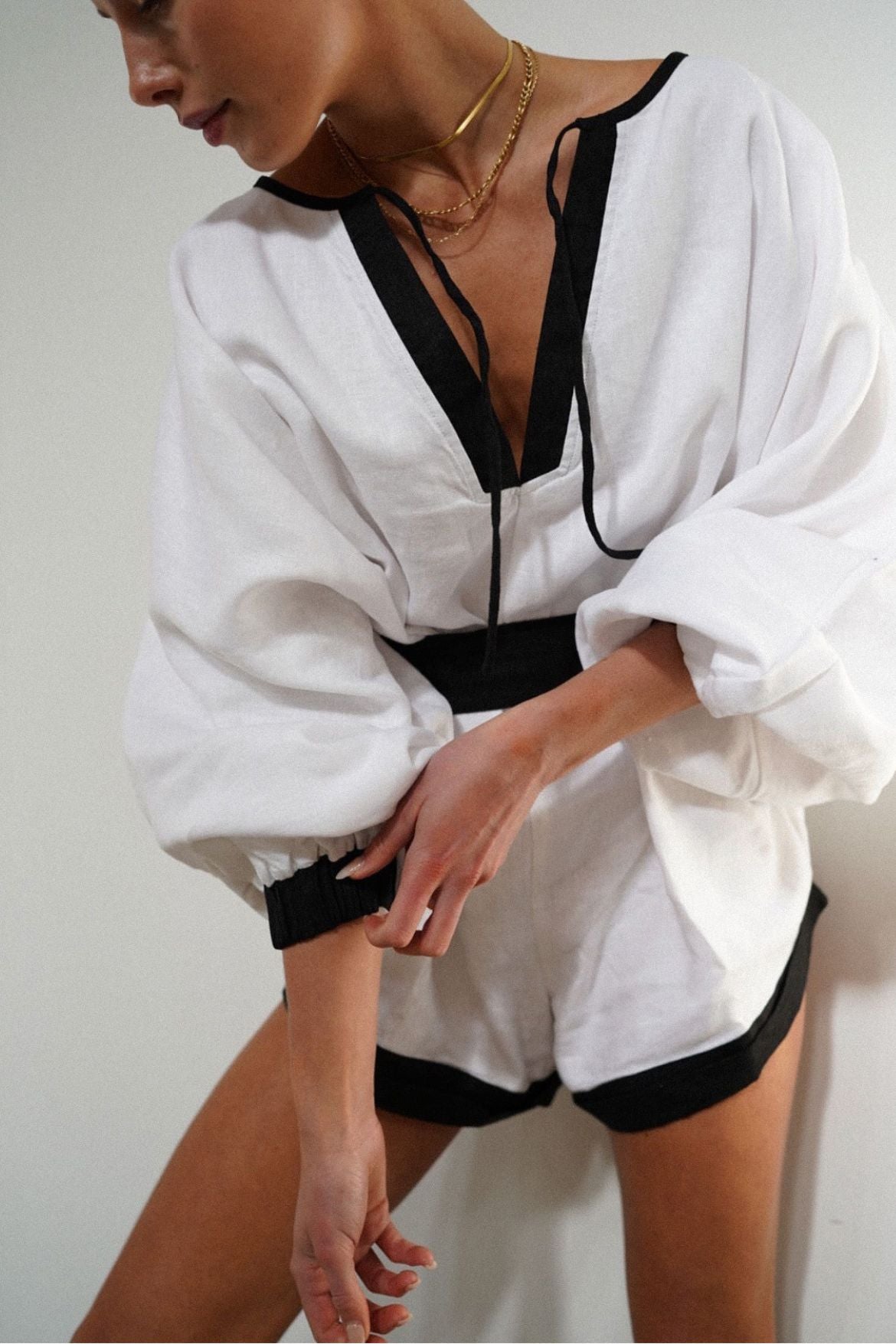 The Ease Label - Keros Romper - Linen batwing romper in white and black