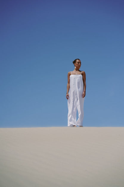 The Ease Iris Jumpsuit - White linen jumpsuit with spaghetti straps to hang off the body