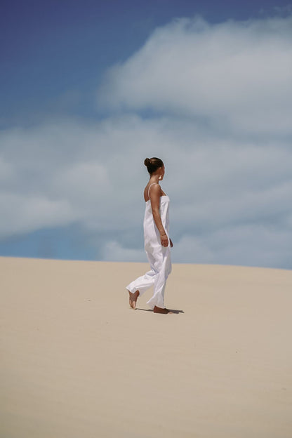 The Ease Iris Jumpsuit - White linen jumpsuit with spaghetti straps to hang off the body