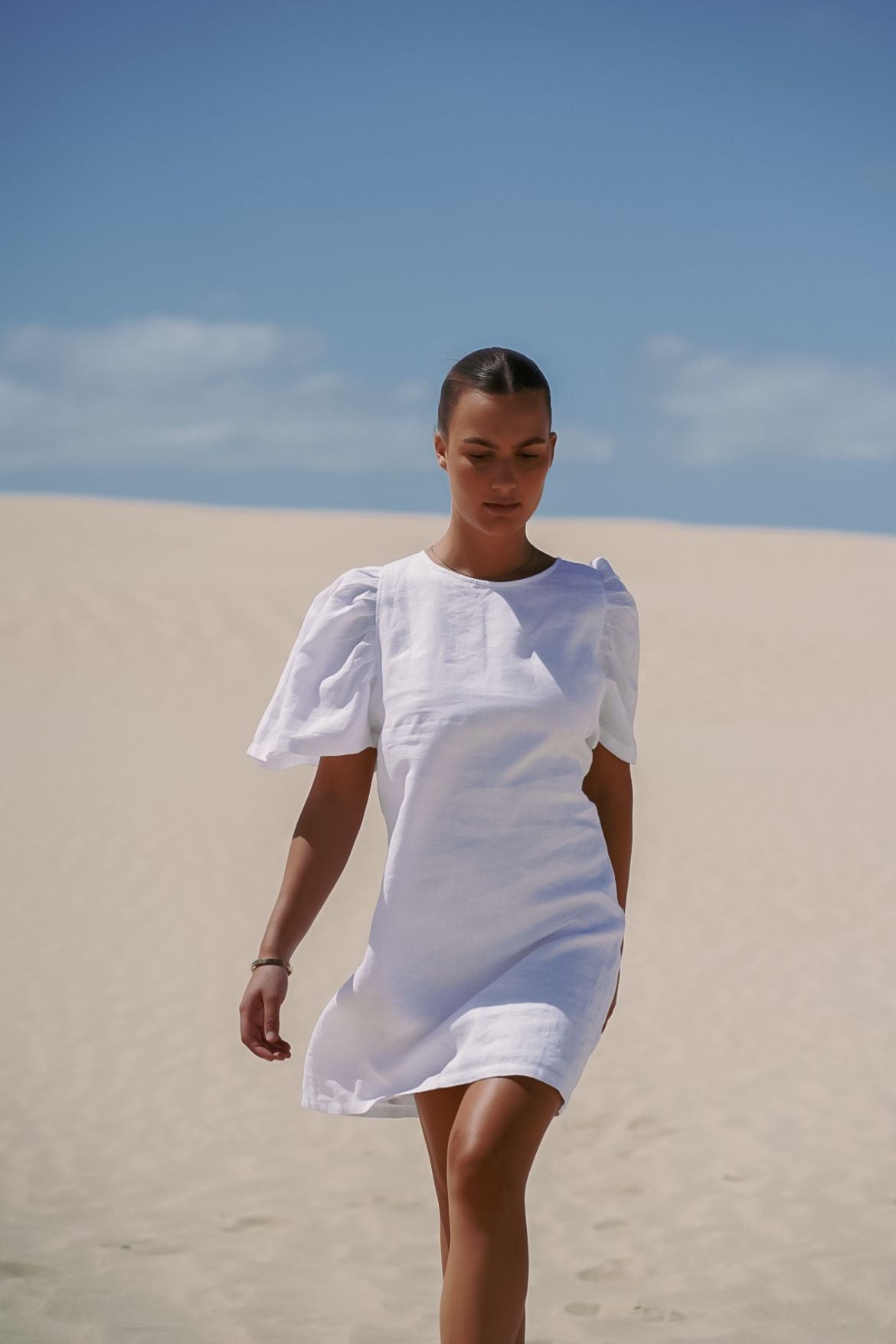 The Ease Florence Mini Dress - White linen mini dress with exaggerated sleeve and tie back