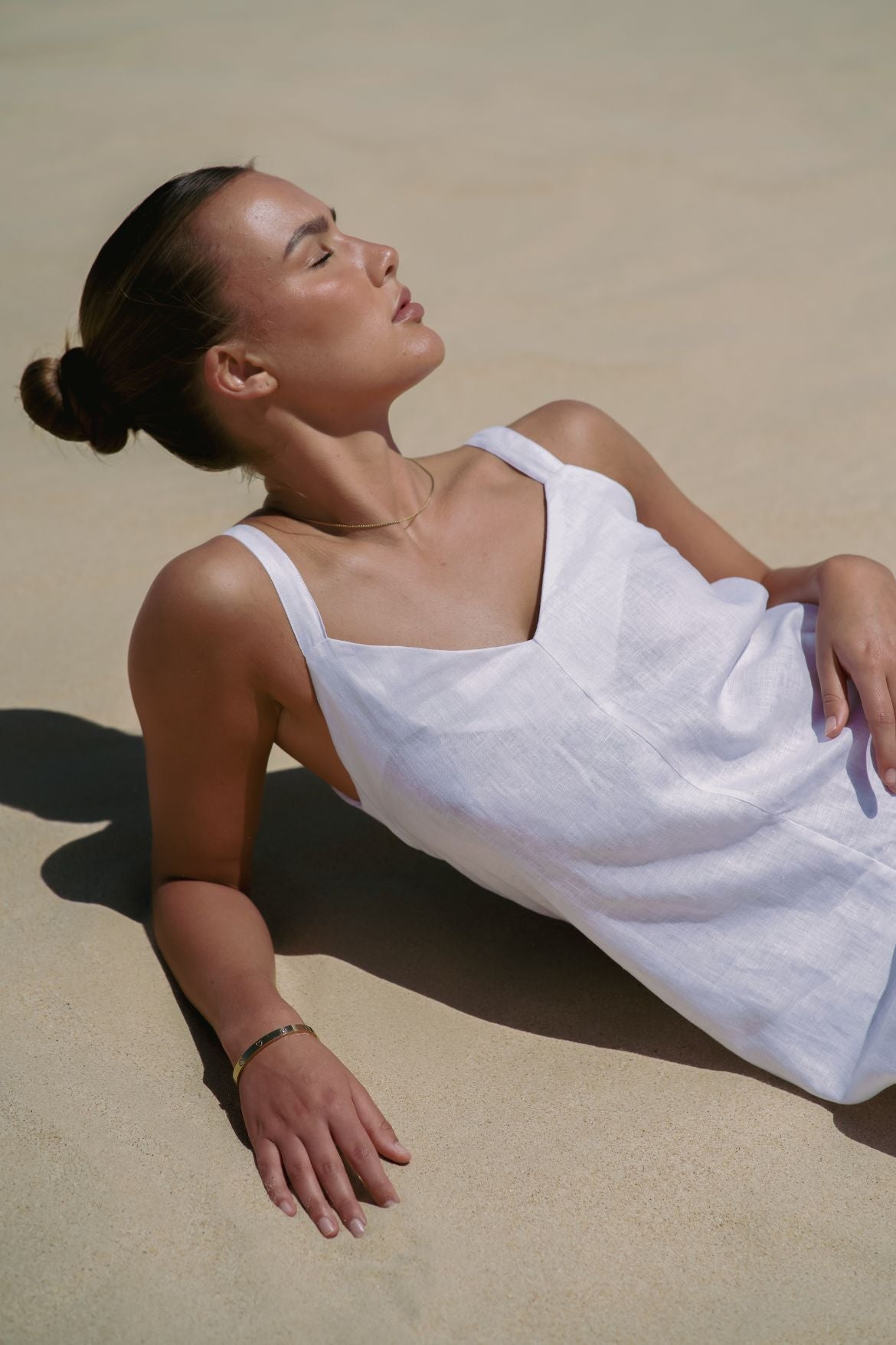 The Ease Imogen dress - Classic white linen shift dress with V neckline and leg splits