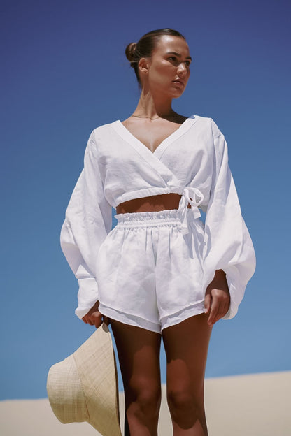 The Ease Sirena Shorts - White Linen flutter shorts with elastic waist
